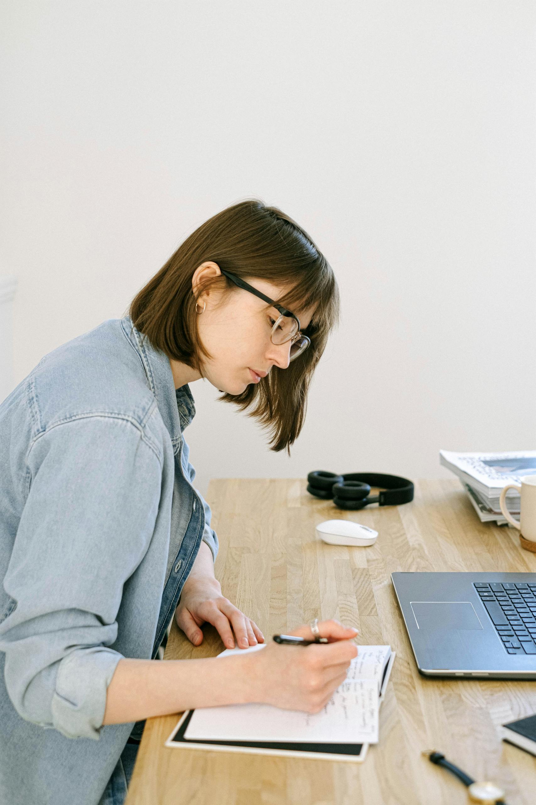 Woman Writing on a Marketing Strategy